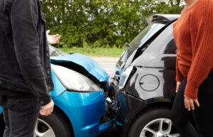 Two motorists argue after a car crash.